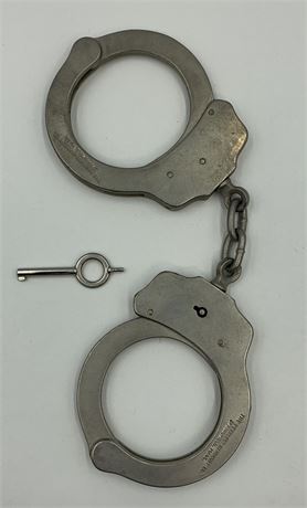 Working Pair of Peerless USA Metal Handcuffs with the Key